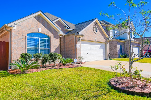 view of property with a front yard and a garage