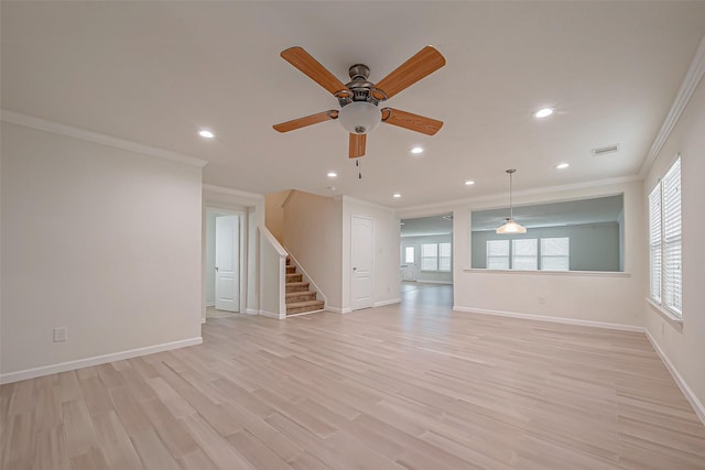 unfurnished living room with ceiling fan, light wood-type flooring, and ornamental molding