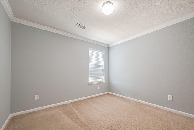 unfurnished room featuring a textured ceiling, carpet floors, and ornamental molding