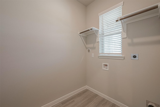 laundry room with hookup for a washing machine, electric dryer hookup, and hardwood / wood-style floors