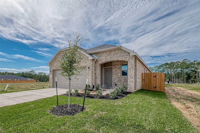 view of front facade with a garage and a front lawn