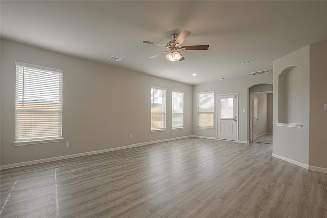 unfurnished room with ceiling fan and light hardwood / wood-style flooring