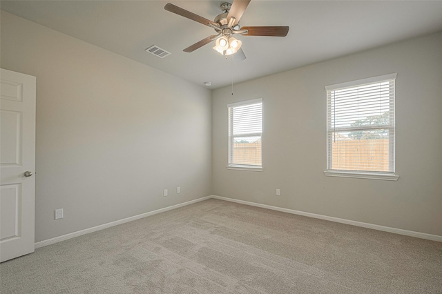 carpeted empty room with ceiling fan