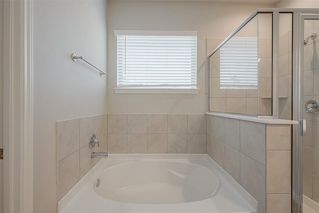 bathroom with separate shower and tub