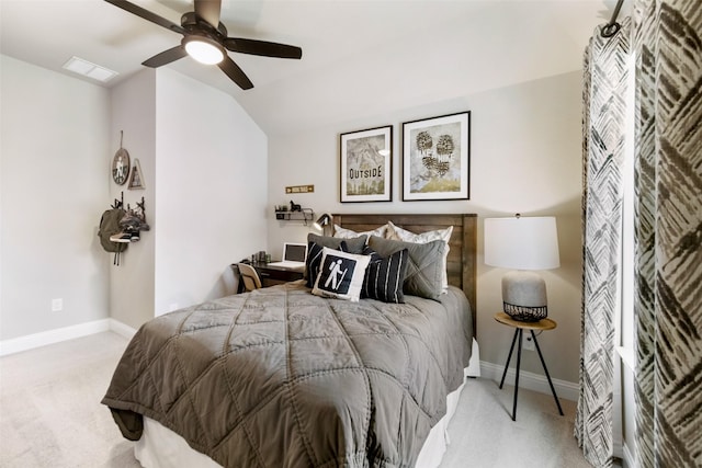 carpeted bedroom featuring visible vents, vaulted ceiling, baseboards, and ceiling fan