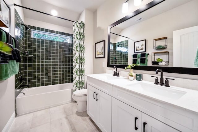 full bathroom featuring toilet, visible vents, shower / bath combo with shower curtain, and a sink