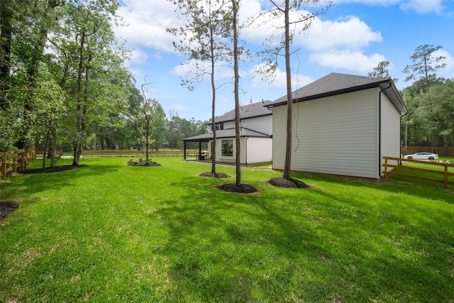 view of yard featuring fence and a gazebo