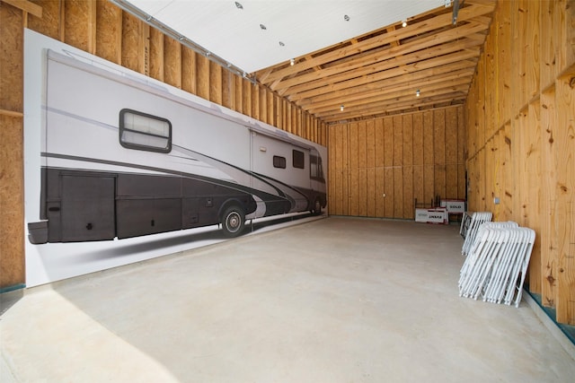 garage featuring wooden walls