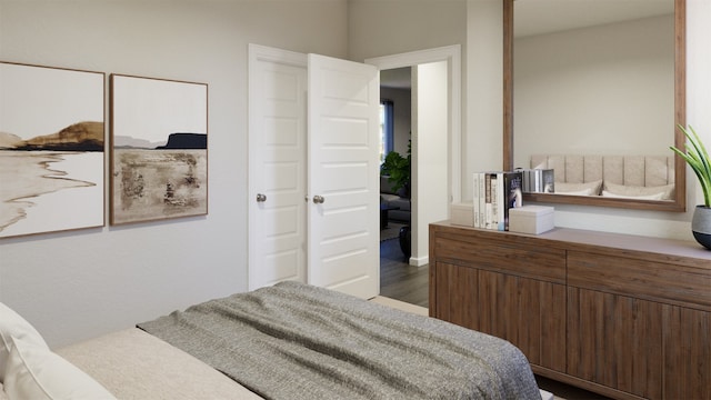 bedroom with dark hardwood / wood-style flooring