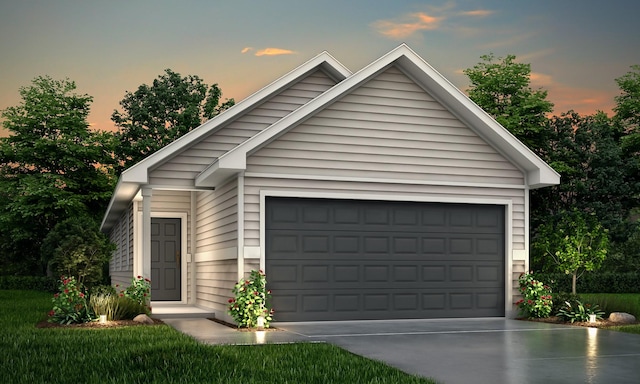 view of garage at dusk