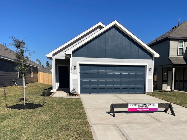 view of front facade with a front yard and a garage