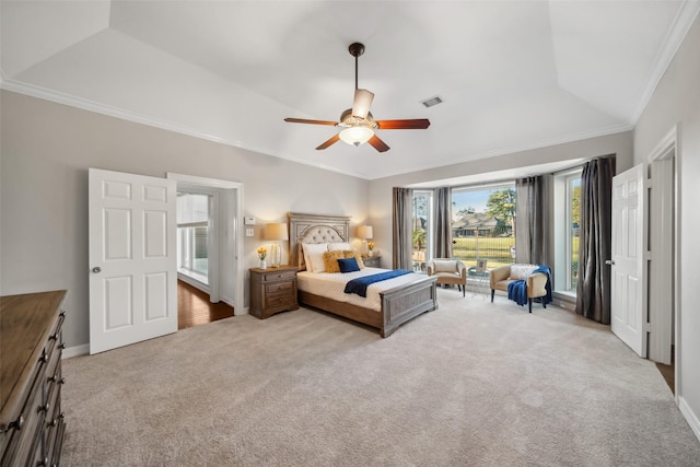 bedroom featuring ceiling fan, light carpet, and multiple windows