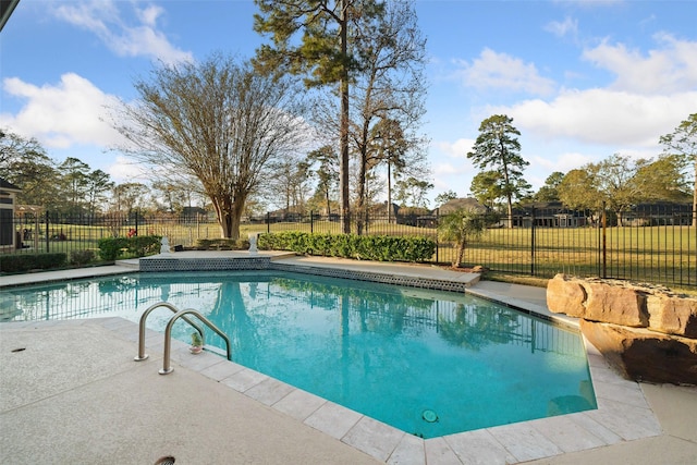 view of swimming pool featuring a patio area