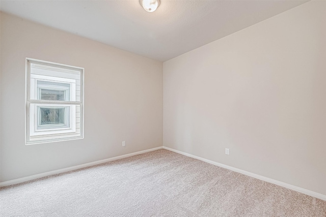 unfurnished room featuring carpet flooring