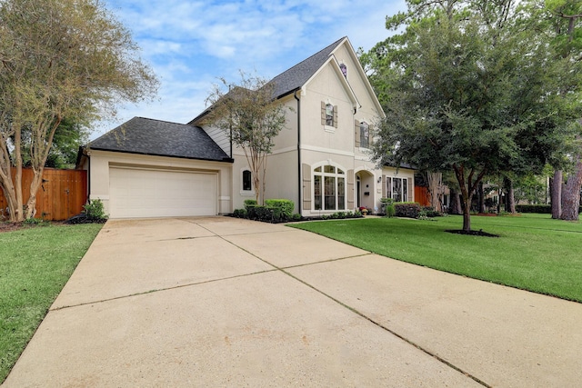 view of front facade with a front yard and a garage