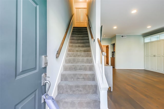 stairs with hardwood / wood-style floors