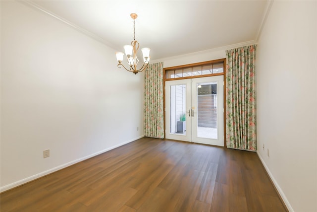 unfurnished room with a chandelier, dark hardwood / wood-style flooring, ornamental molding, and french doors