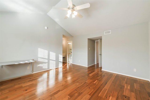 unfurnished room with ceiling fan, hardwood / wood-style floors, and high vaulted ceiling