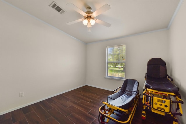 sitting room featuring ceiling fan and ornamental molding