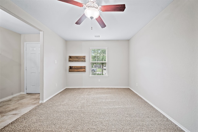 carpeted empty room with ceiling fan