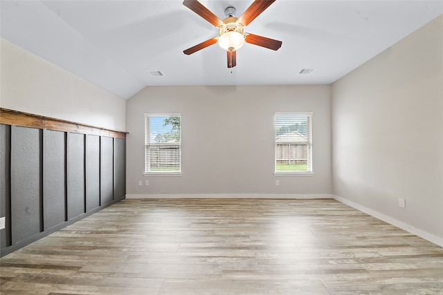 unfurnished bedroom featuring ceiling fan, light hardwood / wood-style flooring, and multiple windows