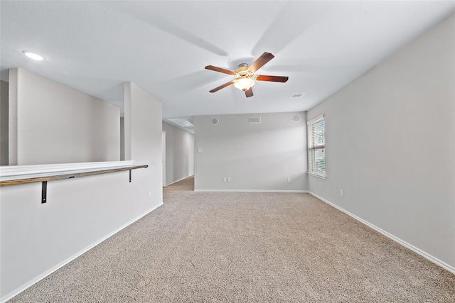 unfurnished room featuring carpet floors and ceiling fan