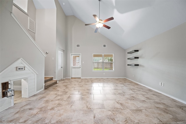 unfurnished living room featuring high vaulted ceiling and ceiling fan