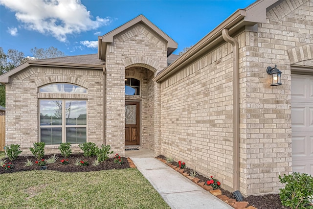 doorway to property featuring a yard