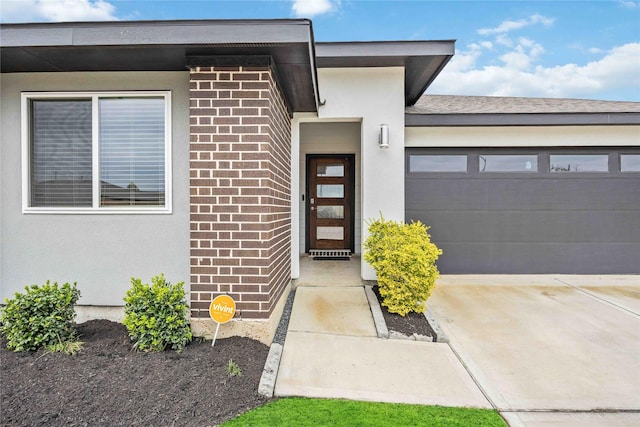 view of exterior entry featuring a garage