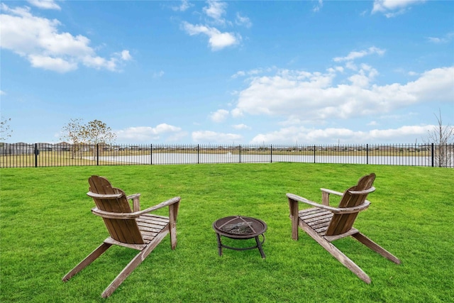 view of yard with a fire pit