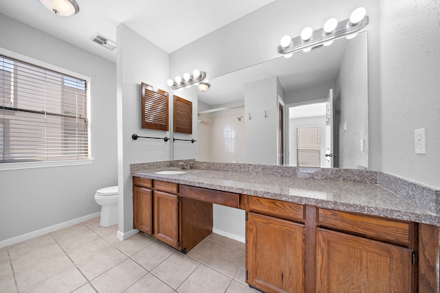 bathroom featuring walk in shower, tile patterned flooring, vanity, and toilet