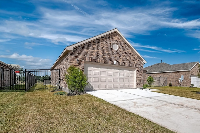 view of side of property with a yard and a garage