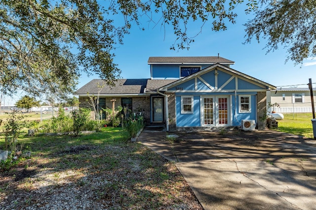 view of front of home featuring ac unit