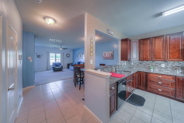 kitchen with sink, ceiling fan, black dishwasher, tasteful backsplash, and light tile patterned flooring