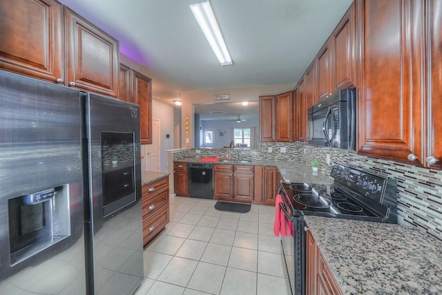 kitchen featuring black appliances, sink, ceiling fan, tasteful backsplash, and light tile patterned flooring