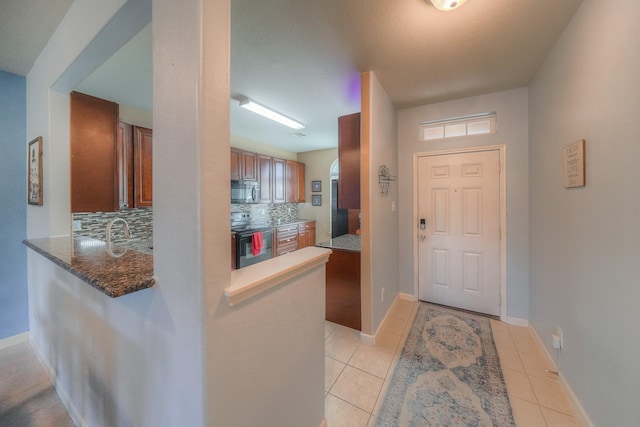 tiled foyer with sink