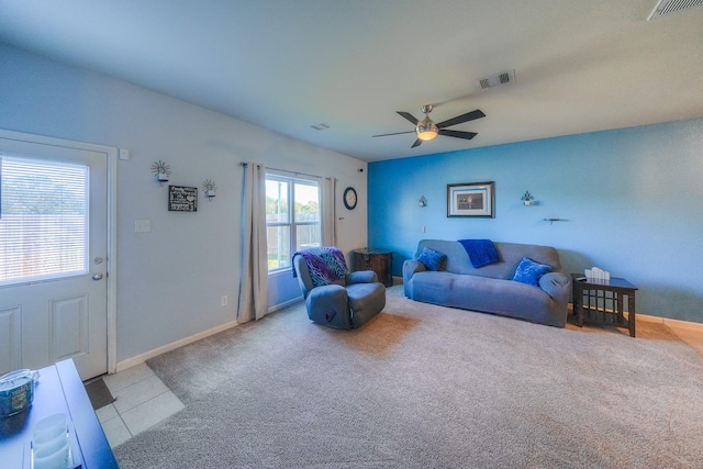 living room with ceiling fan and light tile patterned floors