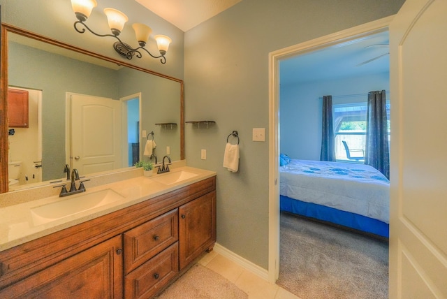 bathroom with tile patterned floors and vanity