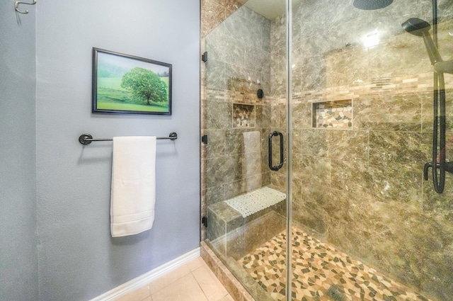 bathroom featuring tile patterned flooring and walk in shower