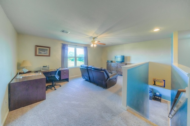 office featuring ceiling fan and light carpet