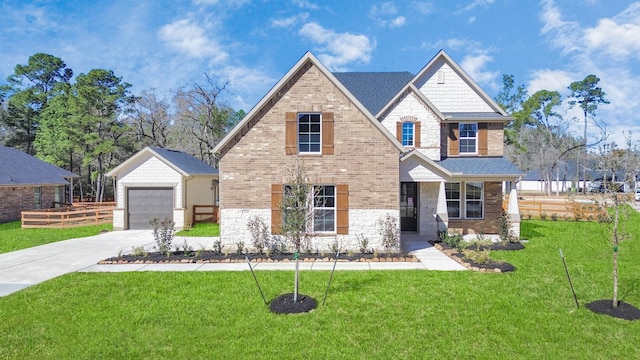 view of front of home with an outbuilding, stone siding, brick siding, and a front lawn