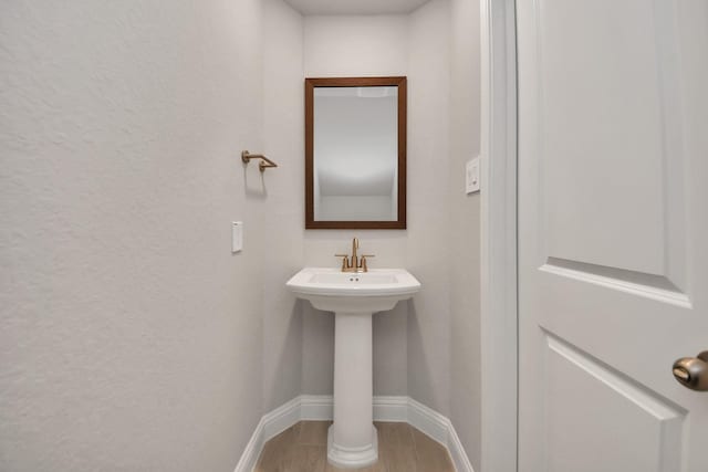 bathroom featuring baseboards