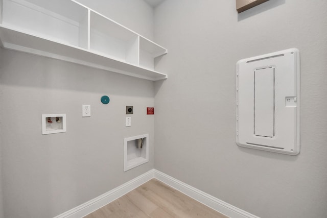 laundry area featuring hookup for a washing machine, light wood-style flooring, laundry area, baseboards, and electric dryer hookup