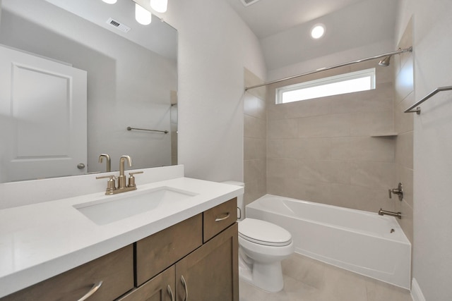 full bathroom with visible vents, toilet, vanity,  shower combination, and tile patterned floors