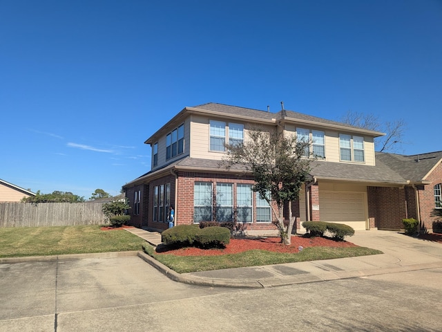 view of front of home with a garage and a front yard