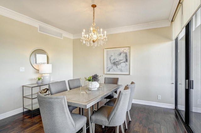 dining area with ornamental molding, a notable chandelier, and dark hardwood / wood-style flooring