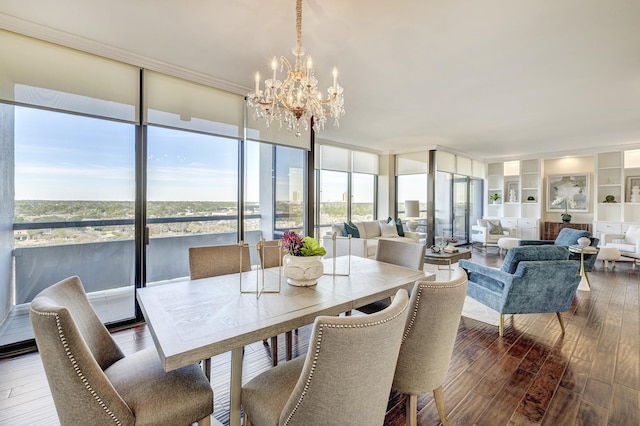 sunroom featuring a notable chandelier