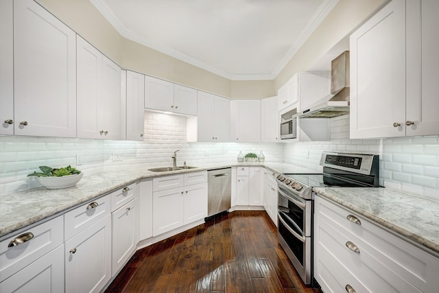 kitchen featuring sink, white cabinets, tasteful backsplash, dark wood-type flooring, and stainless steel appliances