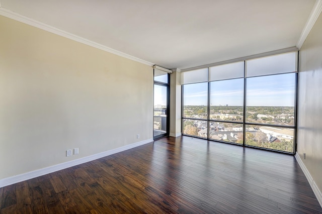 unfurnished room featuring floor to ceiling windows, dark hardwood / wood-style floors, and ornamental molding