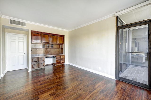 unfurnished living room with built in desk, ornamental molding, and dark hardwood / wood-style floors